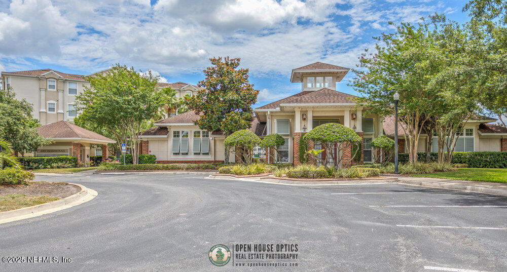 7801 Point Meadows Drive, Unit 3209 Jacksonville, FL 32256 - Photo 29 of 34 a front view of a house with a yard