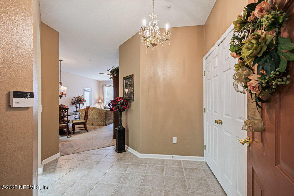 7801 Point Meadows Drive, Unit 3209 Jacksonville, FL 32256 - Photo 8 of 34 a view of a hallway with workspace and entryway