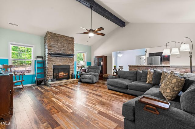 a bed room with a bed and a chair