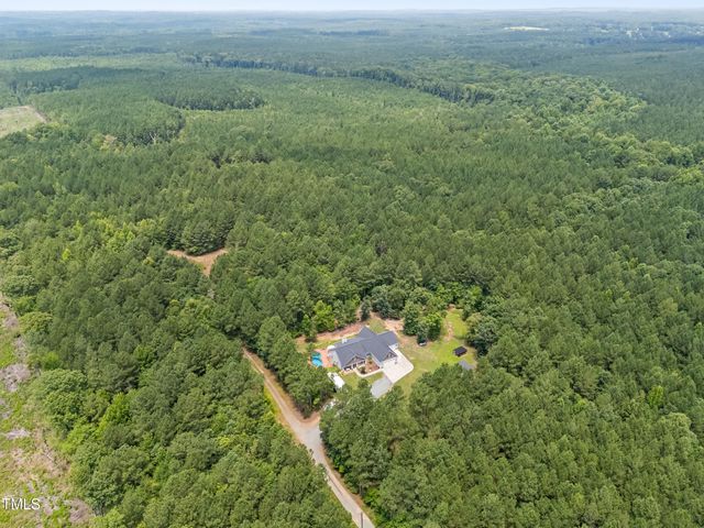 a view of a field with an ocean view