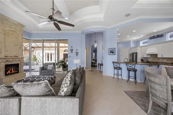 a dining area with stainless steel appliances kitchen island a table and chairs in it