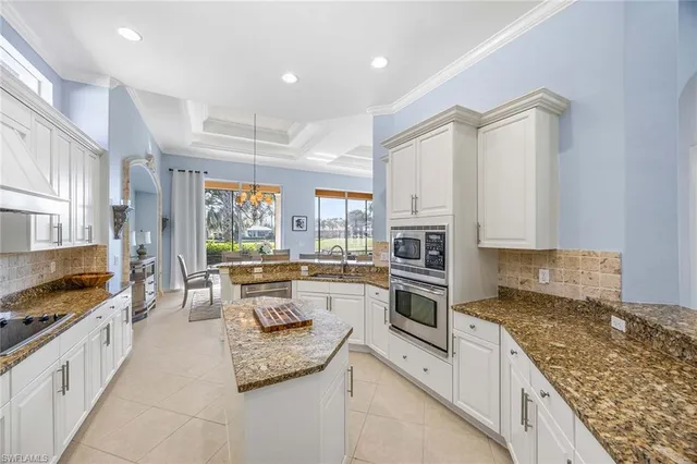 a view of a patio with table and chairs potted plants with wooden floor