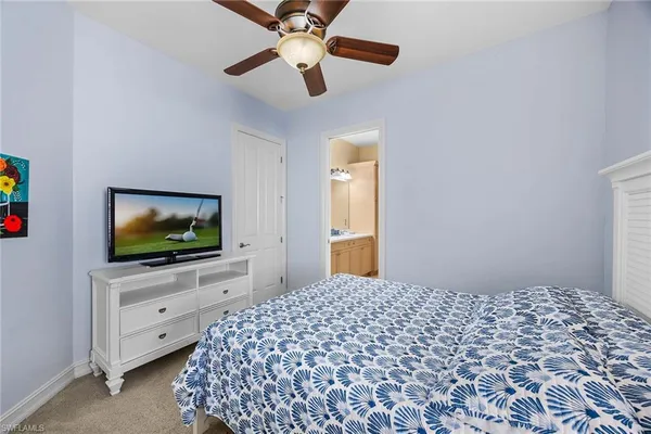 a spacious bathroom with a double vanity sink and a mirror
