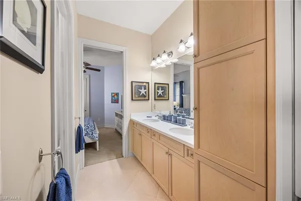 a bathroom with a glass door shower and a toilet