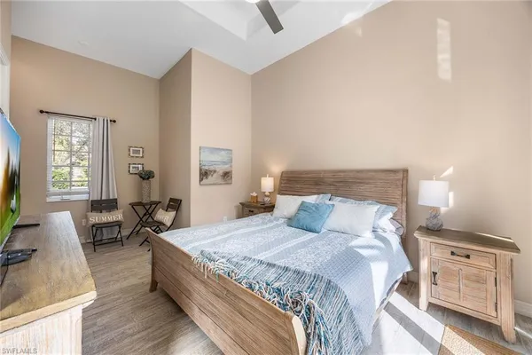 a kitchen with a table chairs and a refrigerator
