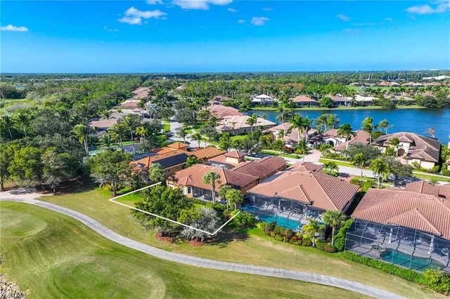 a living room with furniture ceiling fan and a large window