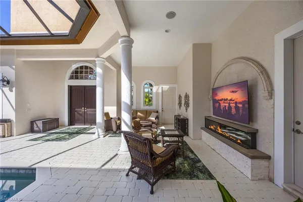 a view of swimming pool with seating space