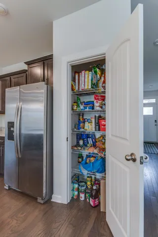 a kitchen with a center island and stainless steel appliances