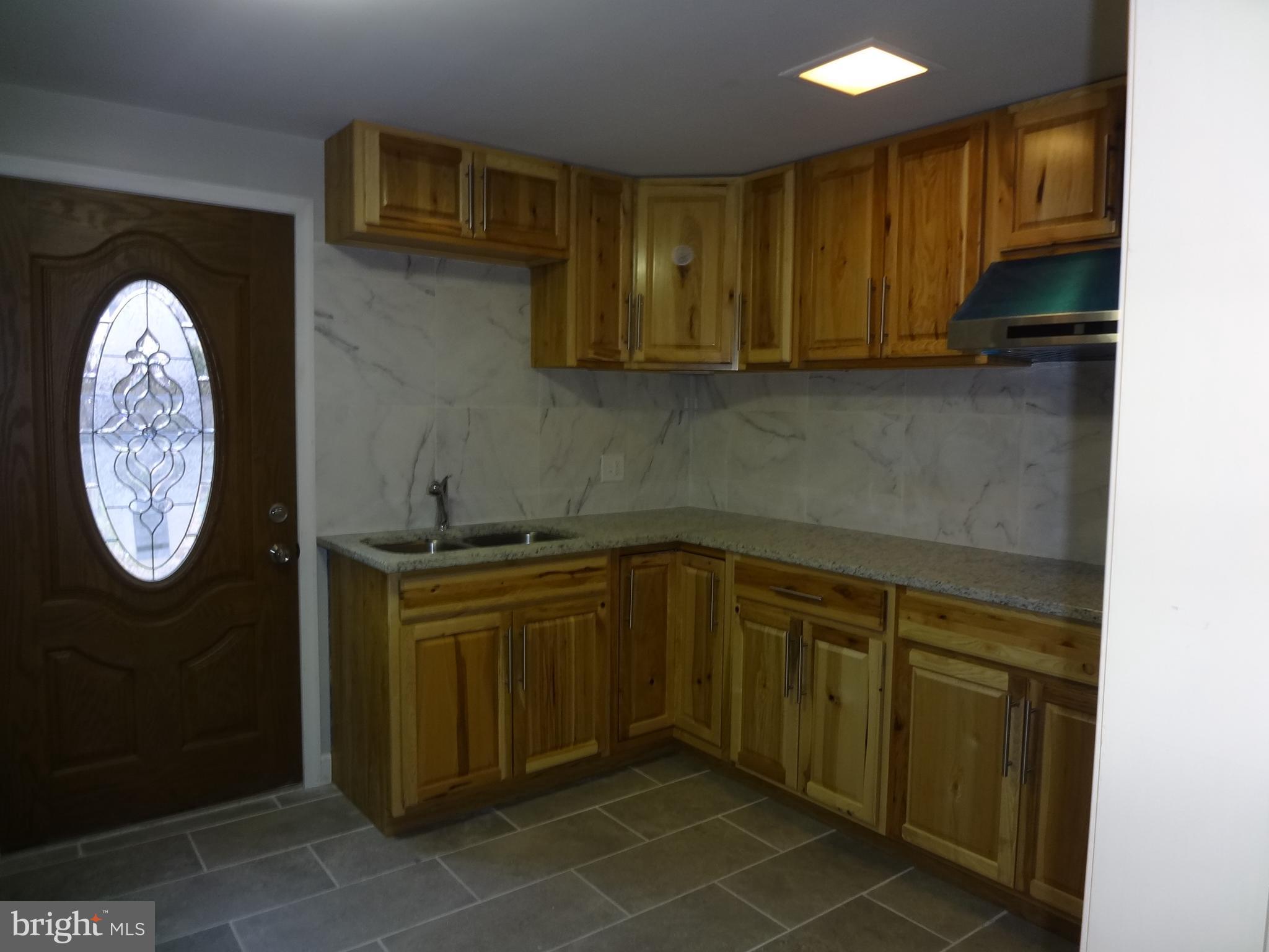 103 North Kennedy Road Sterling, VA 20164 - Photo 21 of 28 Basement Wetbar view 2