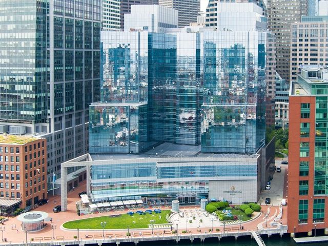 a front view of a building with a garden