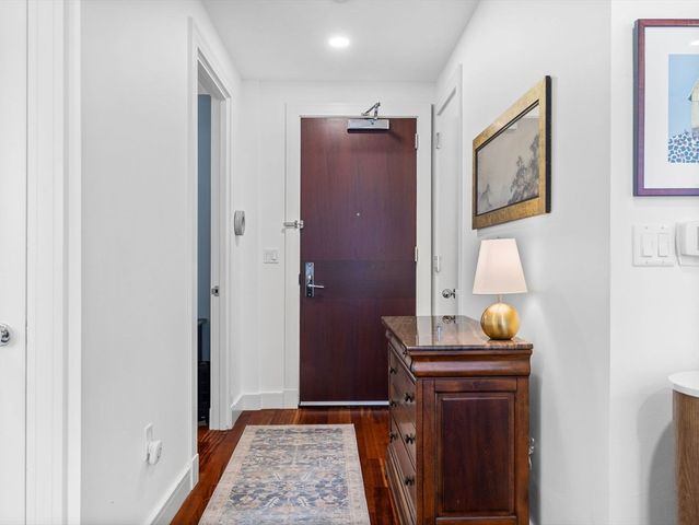 a view of bathroom with a table and a mirror