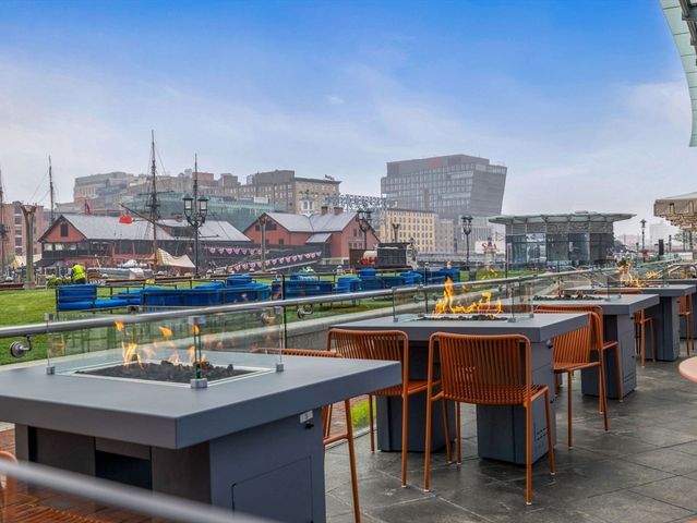 a view of a chairs and table in a terrace