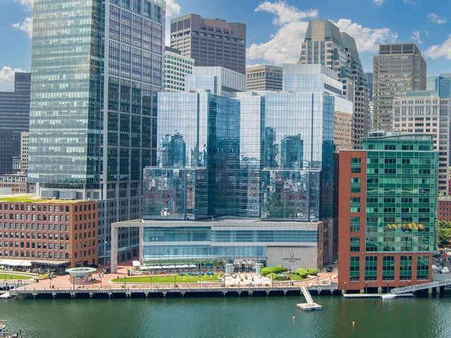 a view of a lake with tall buildings