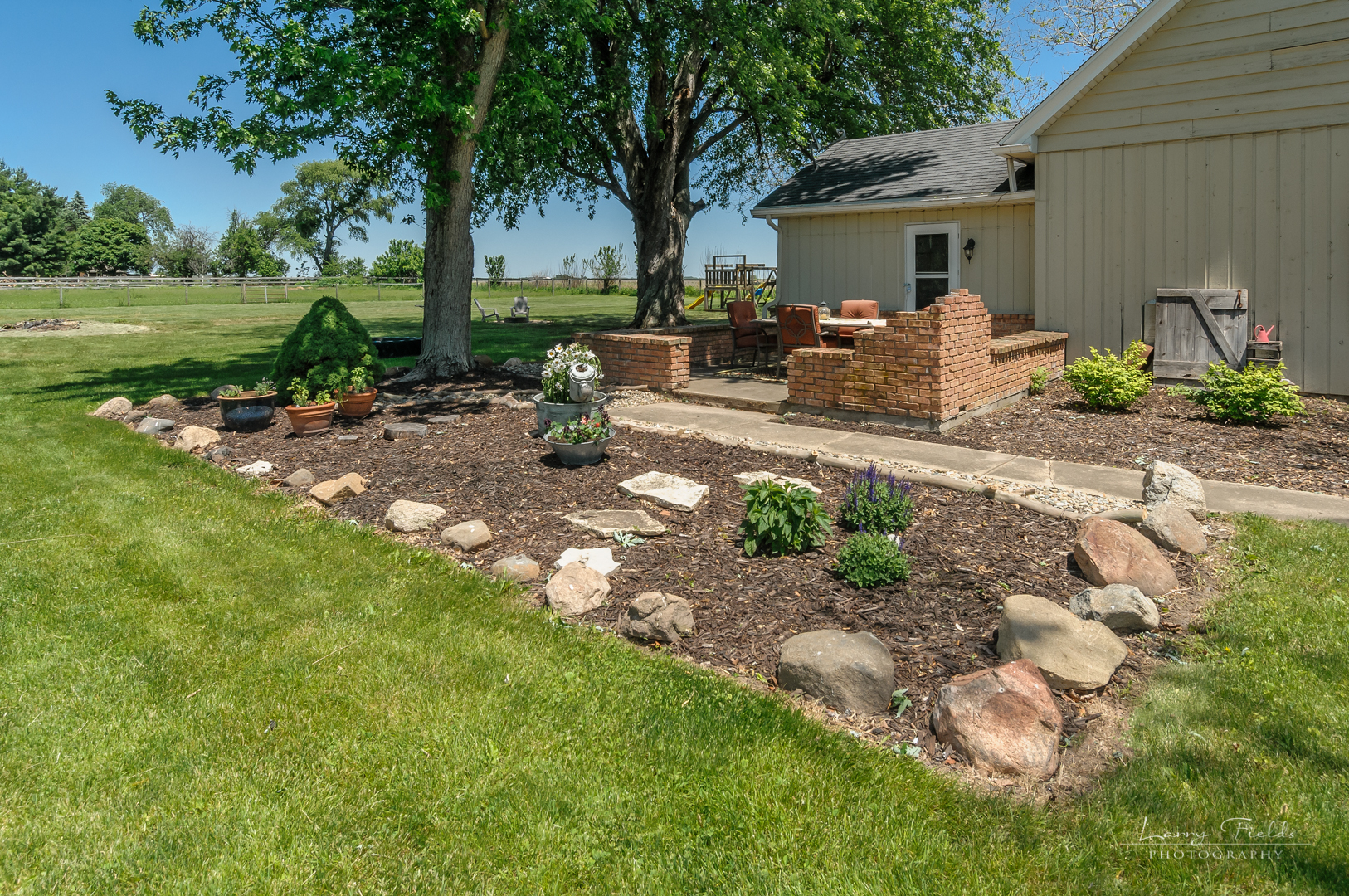 14725 Sears Road Plano, IL 60545 - Photo 23 of 26 a front view of a house with garden
