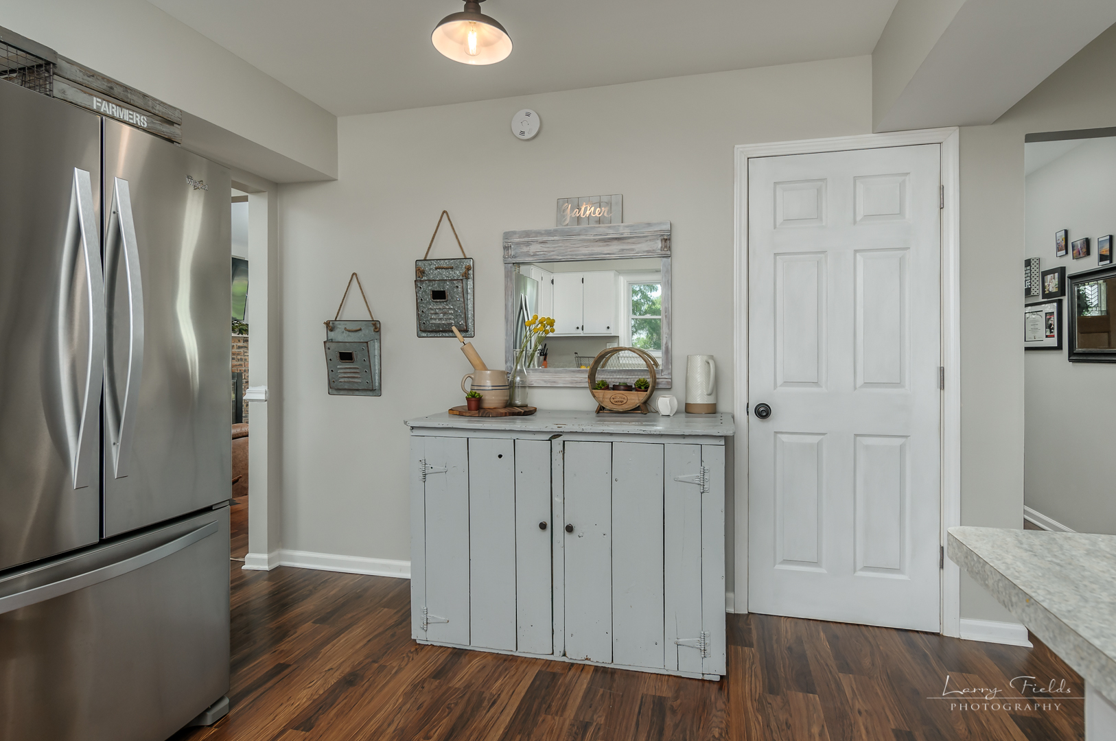 14725 Sears Road Plano, IL 60545 - Photo 9 of 26 a kitchen with a refrigerator and cabinets