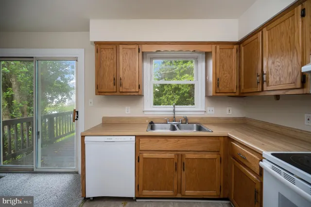 a kitchen with a refrigerator stove and cabinets
