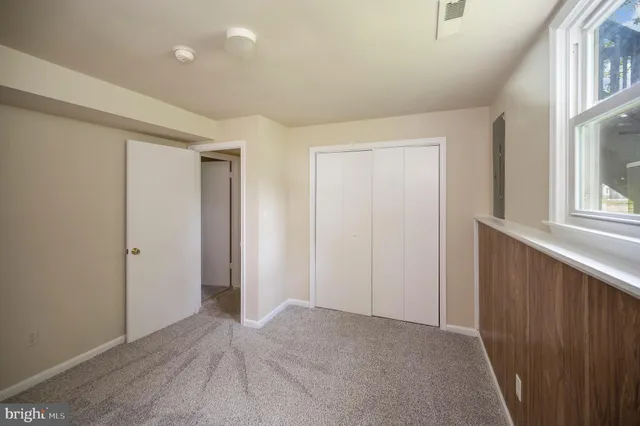 a view of a wooden deck with a yard