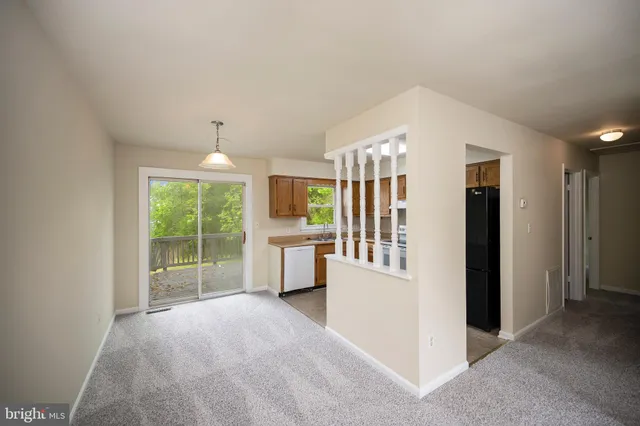 a kitchen with a refrigerator stove and sink