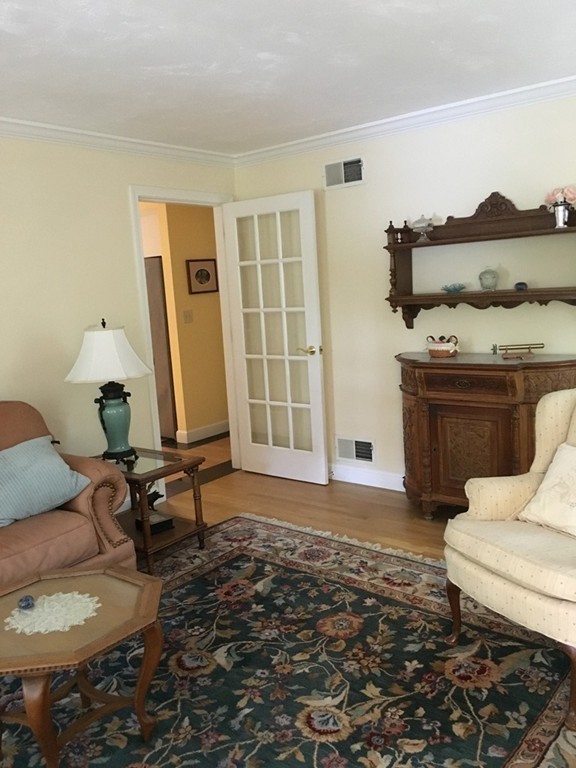 134 Kettle Hole Road Bolton, MA 01740 - Photo 15 of 29 a living room with furniture and a floor to ceiling window