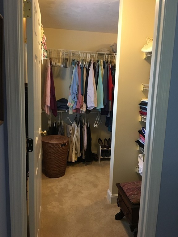 134 Kettle Hole Road Bolton, MA 01740 - Photo 19 of 29 a view of walk in closet with clothes and shoes