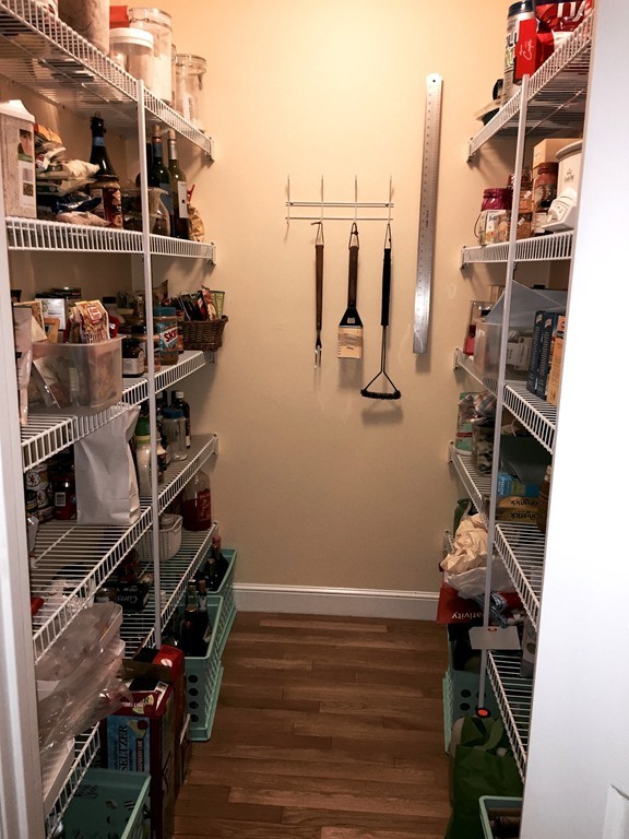 134 Kettle Hole Road Bolton, MA 01740 - Photo 7 of 29 a view of walk in closet with clothes and shoes