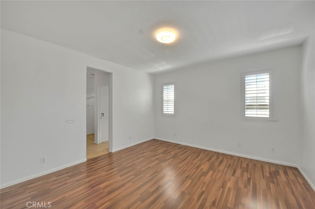 8150 West Preserve Loop Chino, CA 91708 - Photo 29 of 51 wooden floor in an empty room with a window