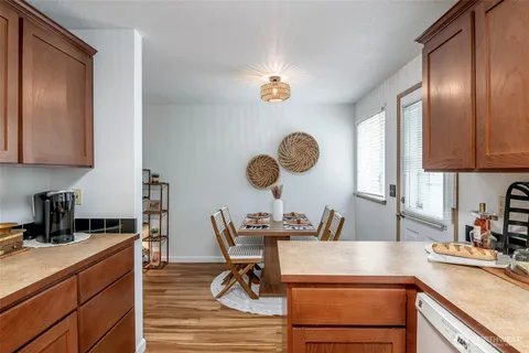 a view of a kitchen with a sink and cabinets