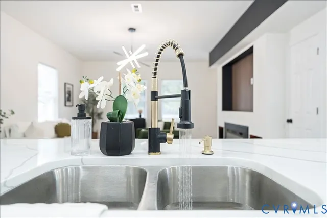 a kitchen with a sink a counter and cabinets