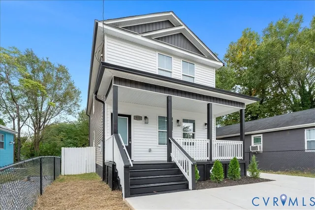 a front view of a house with garage