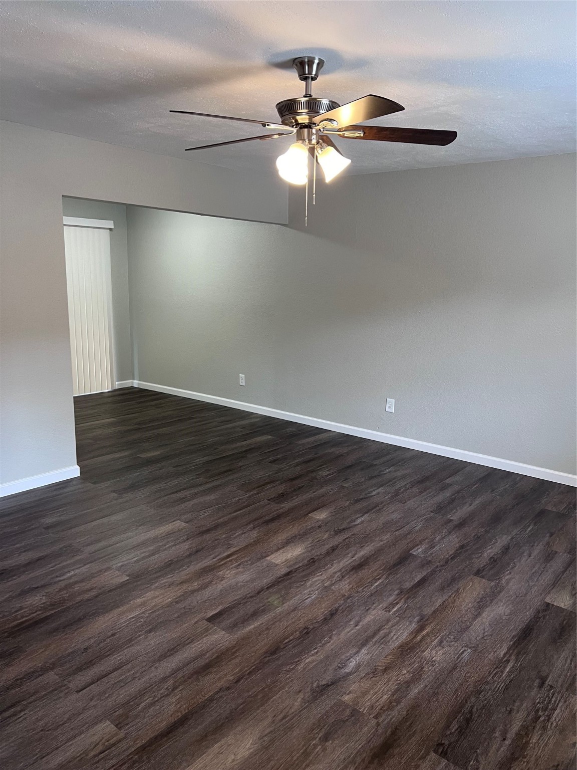 503 Park Lane, Unit 3 Cleveland, TX 77327 - Photo 2 of 5 a view of an empty room with wooden floor
