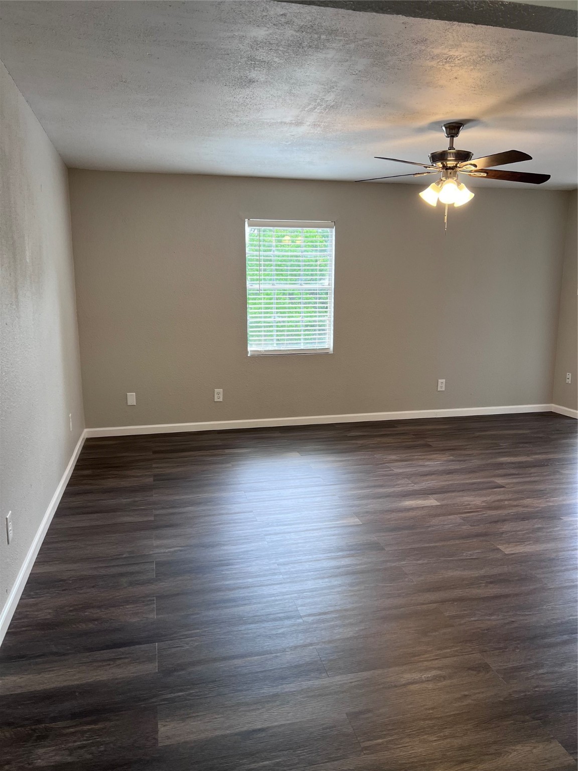 503 Park Lane, Unit 3 Cleveland, TX 77327 - Photo 3 of 5 a view of room with window and wooden floor