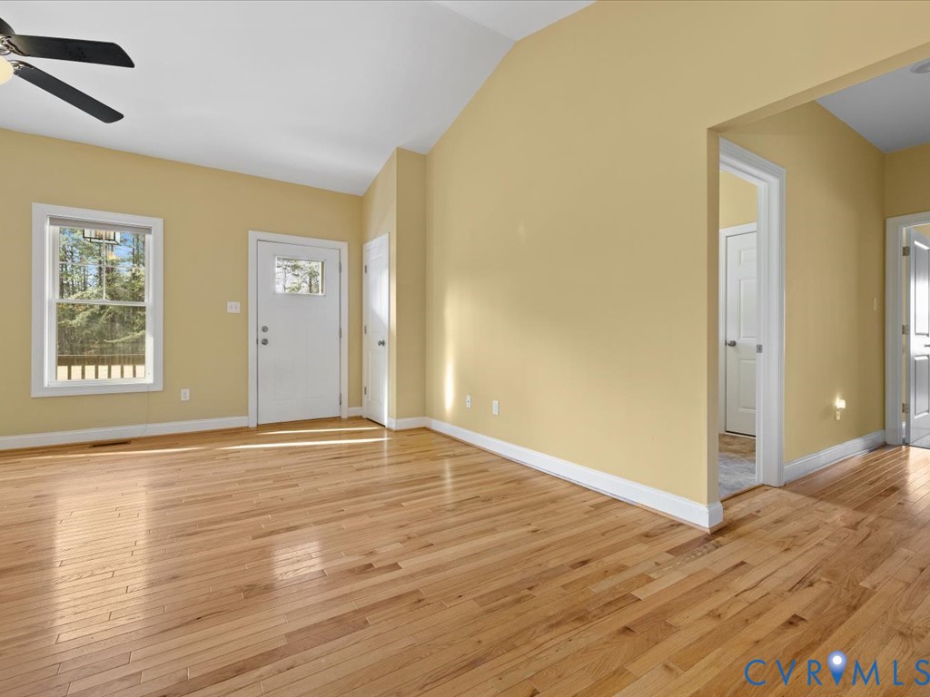 2806 Perkinsville Road Maidens, VA 23102 - Photo 15 of 38 a view of an empty room with wooden floor and a window