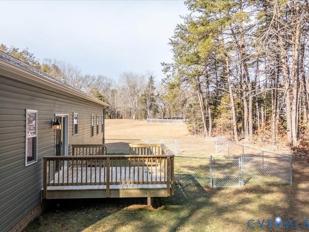 2806 Perkinsville Road Maidens, VA 23102 - Photo 26 of 38 a view of a roof deck with wooden fence and floor