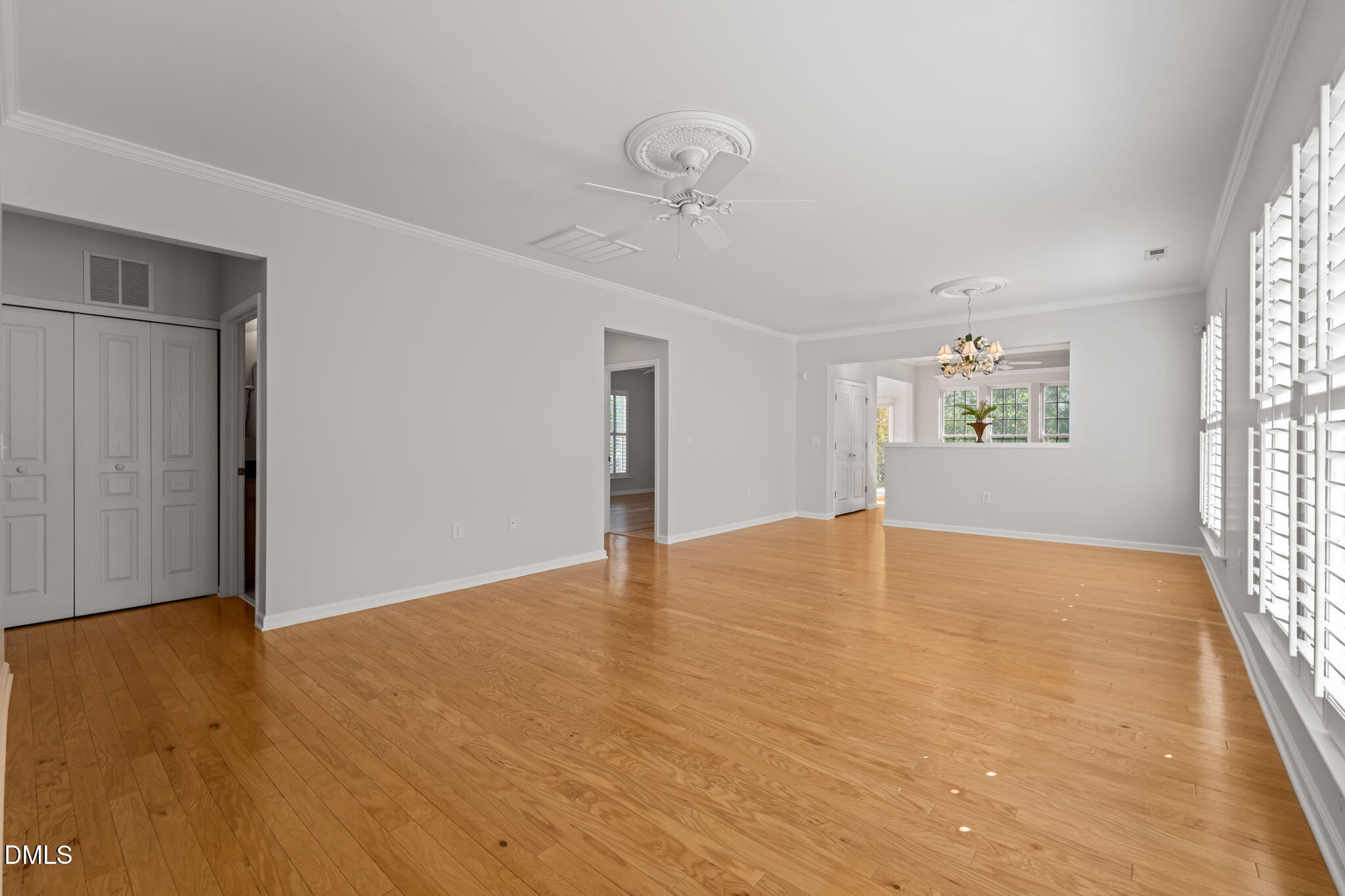 555 Tomkins Loop Cary, NC 27519 - Photo 14 of 50 wooden floor in an empty room with a window