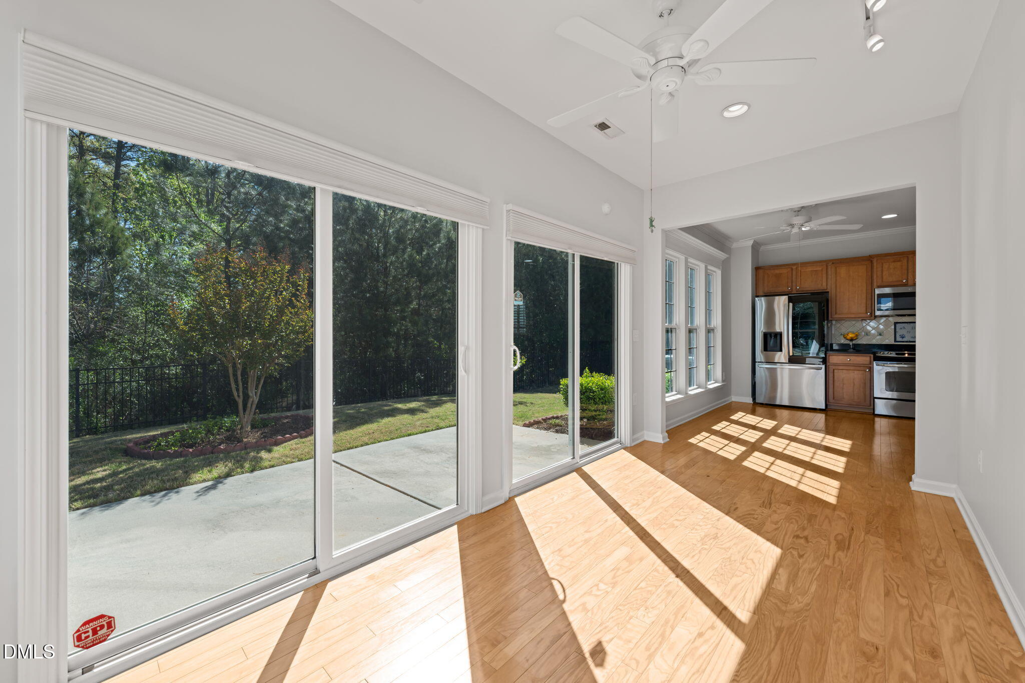 555 Tomkins Loop Cary, NC 27519 - Photo 20 of 50 a very nice looking room with a large window and chandelier