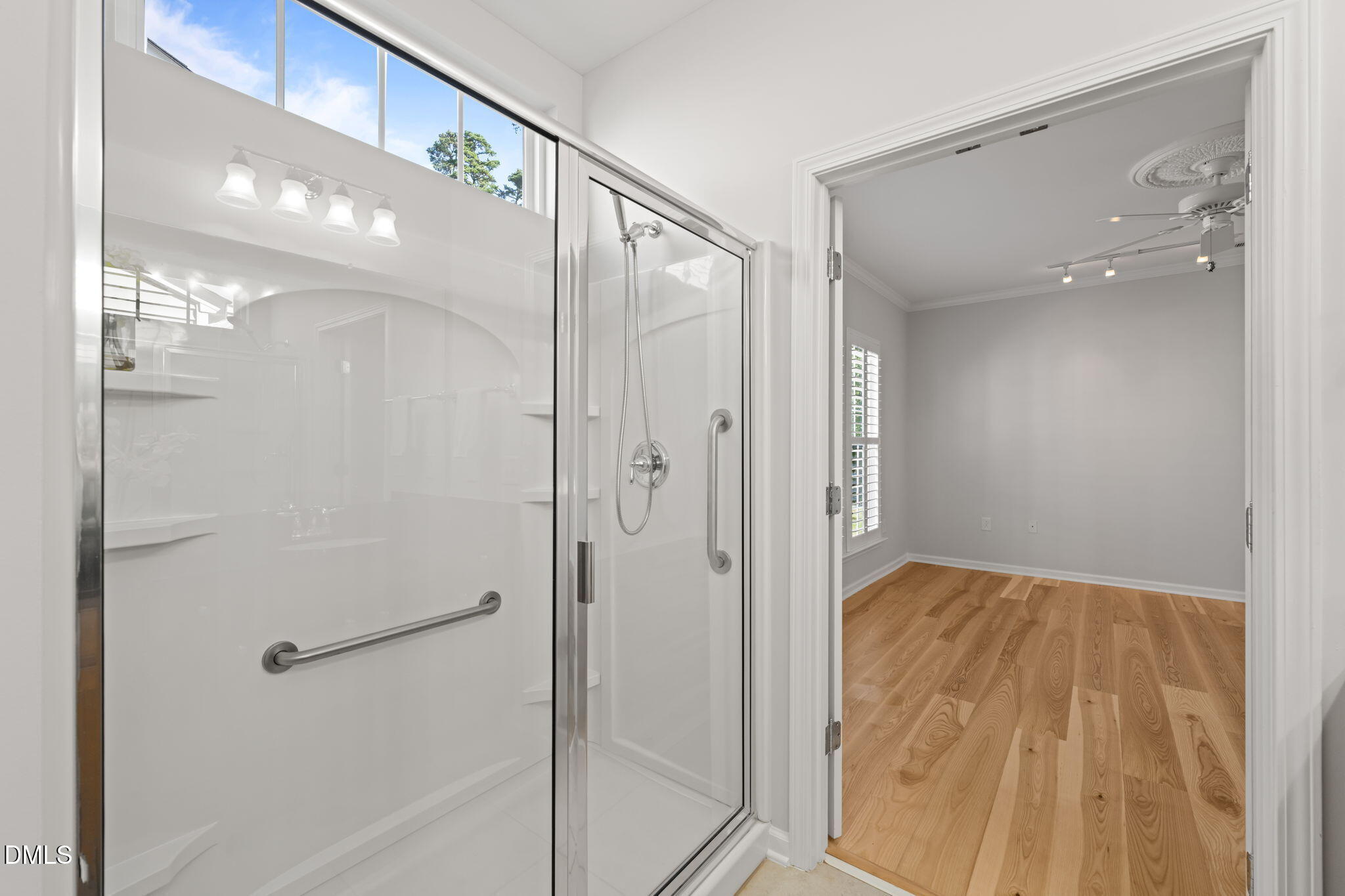 555 Tomkins Loop Cary, NC 27519 - Photo 25 of 50 a bathroom with a shower and a glass door