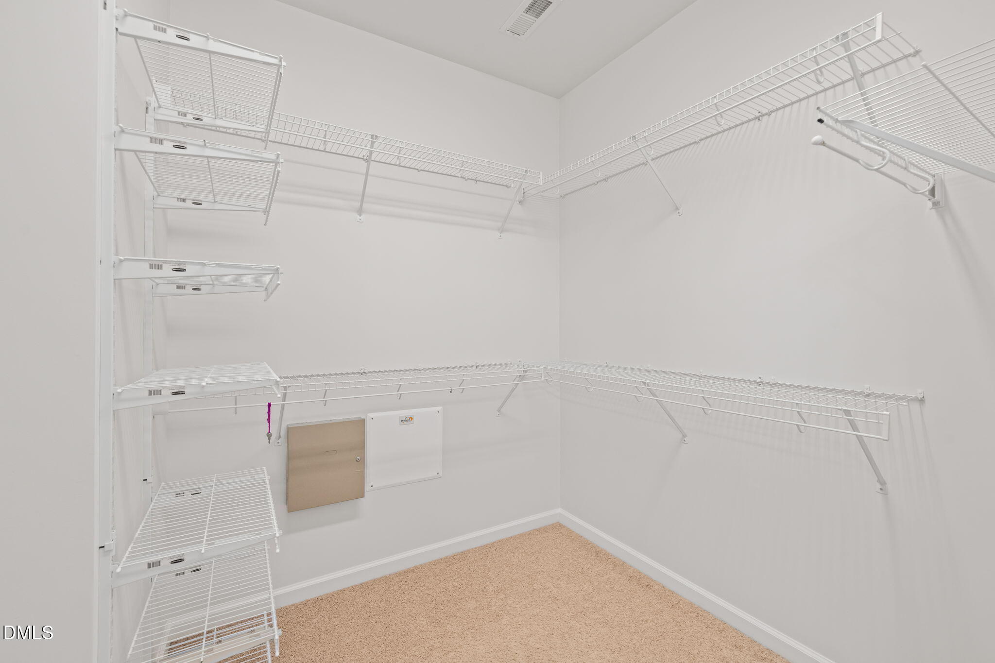 555 Tomkins Loop Cary, NC 27519 - Photo 26 of 50 a view of a room with racks on the wall