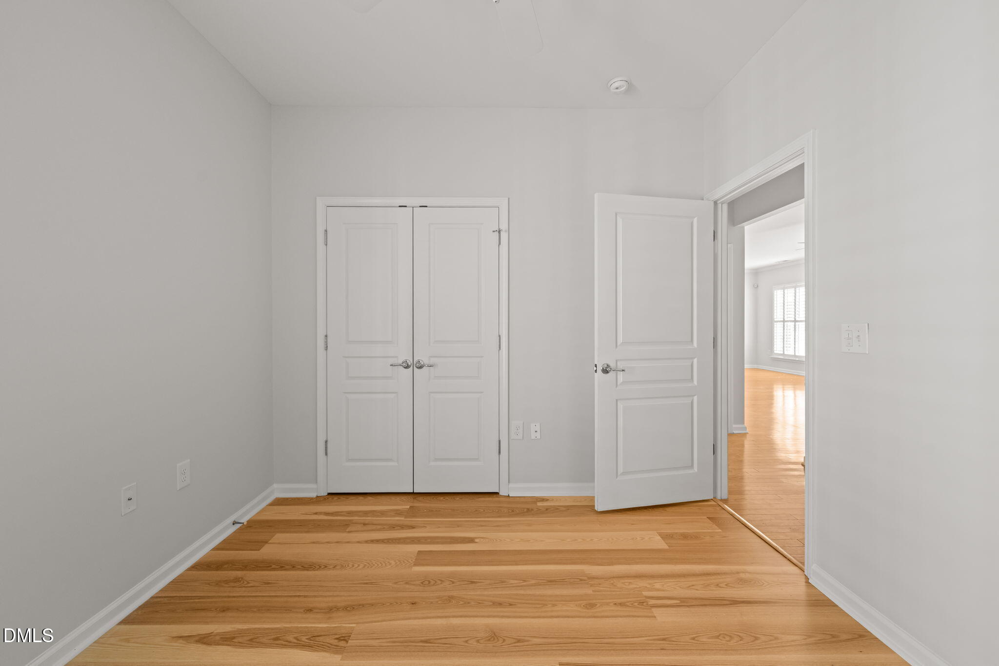 555 Tomkins Loop Cary, NC 27519 - Photo 28 of 50 a view of an empty room with wooden floor