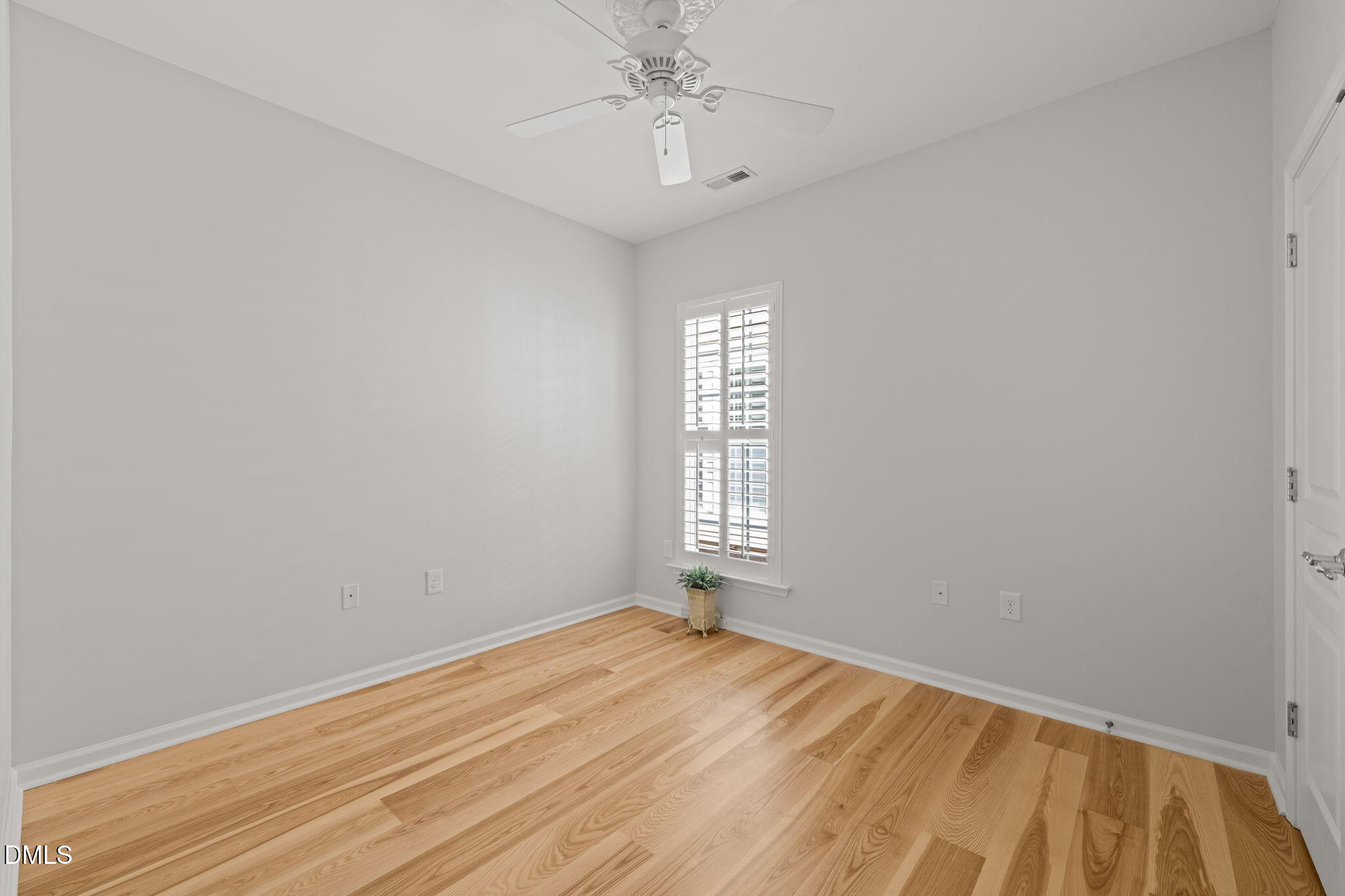 555 Tomkins Loop Cary, NC 27519 - Photo 29 of 50 wooden floor in an empty room with a window