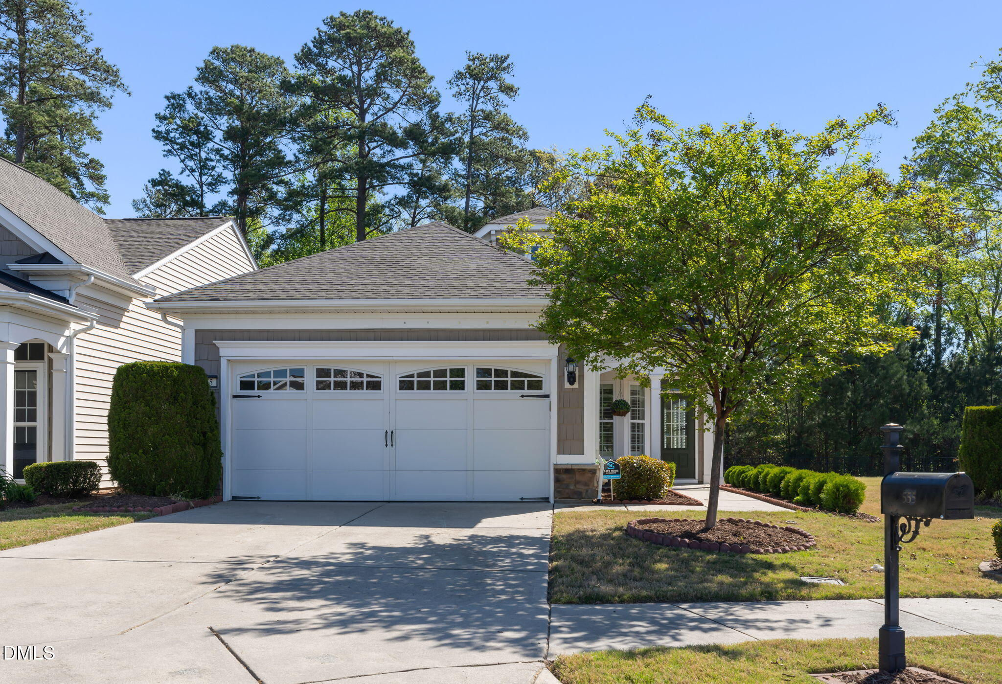 555 Tomkins Loop Cary, NC 27519 - Photo 2 of 50 a front view of a house with garden