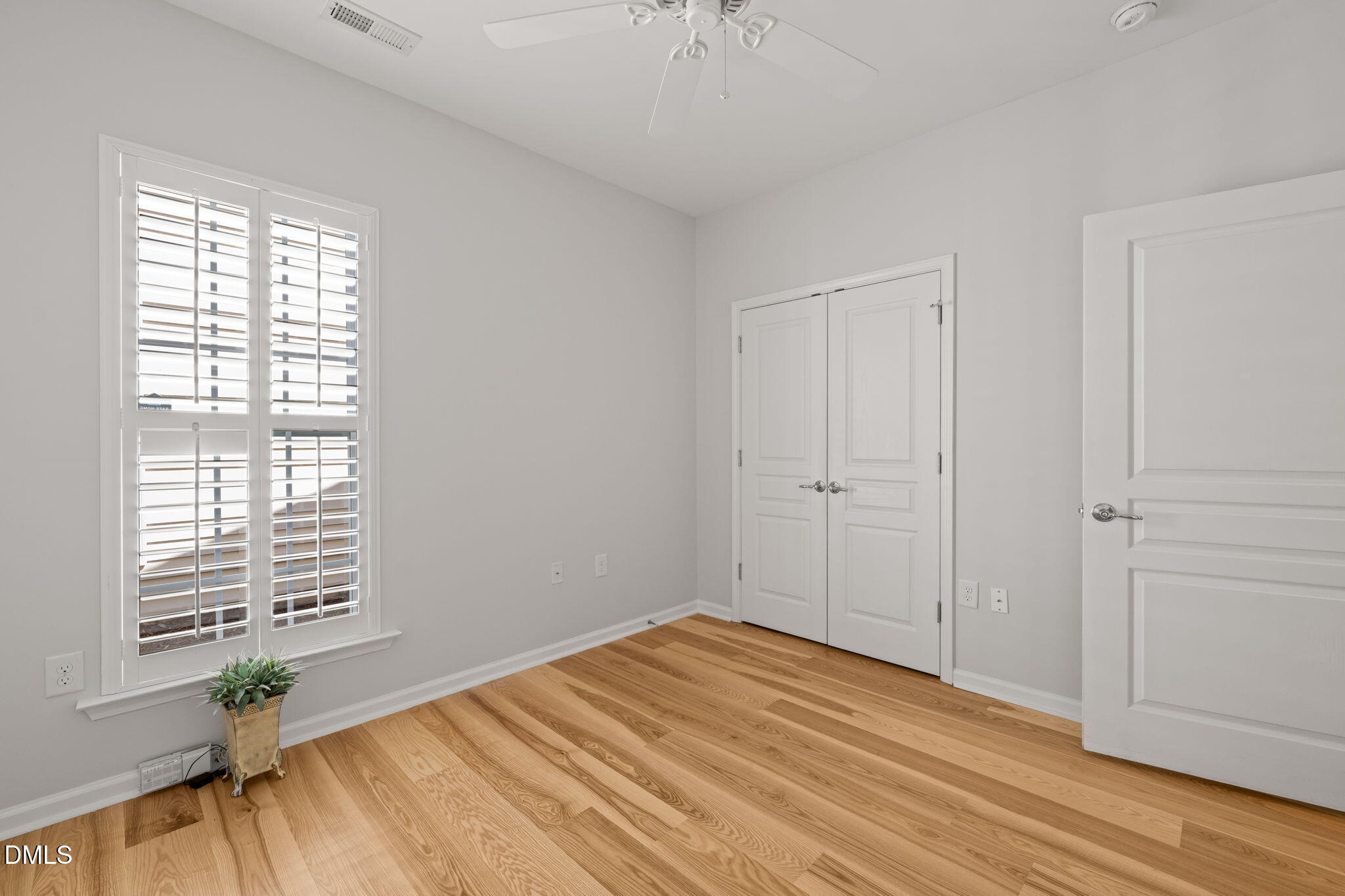 555 Tomkins Loop Cary, NC 27519 - Photo 30 of 50 a view of empty room with wooden floor and fan