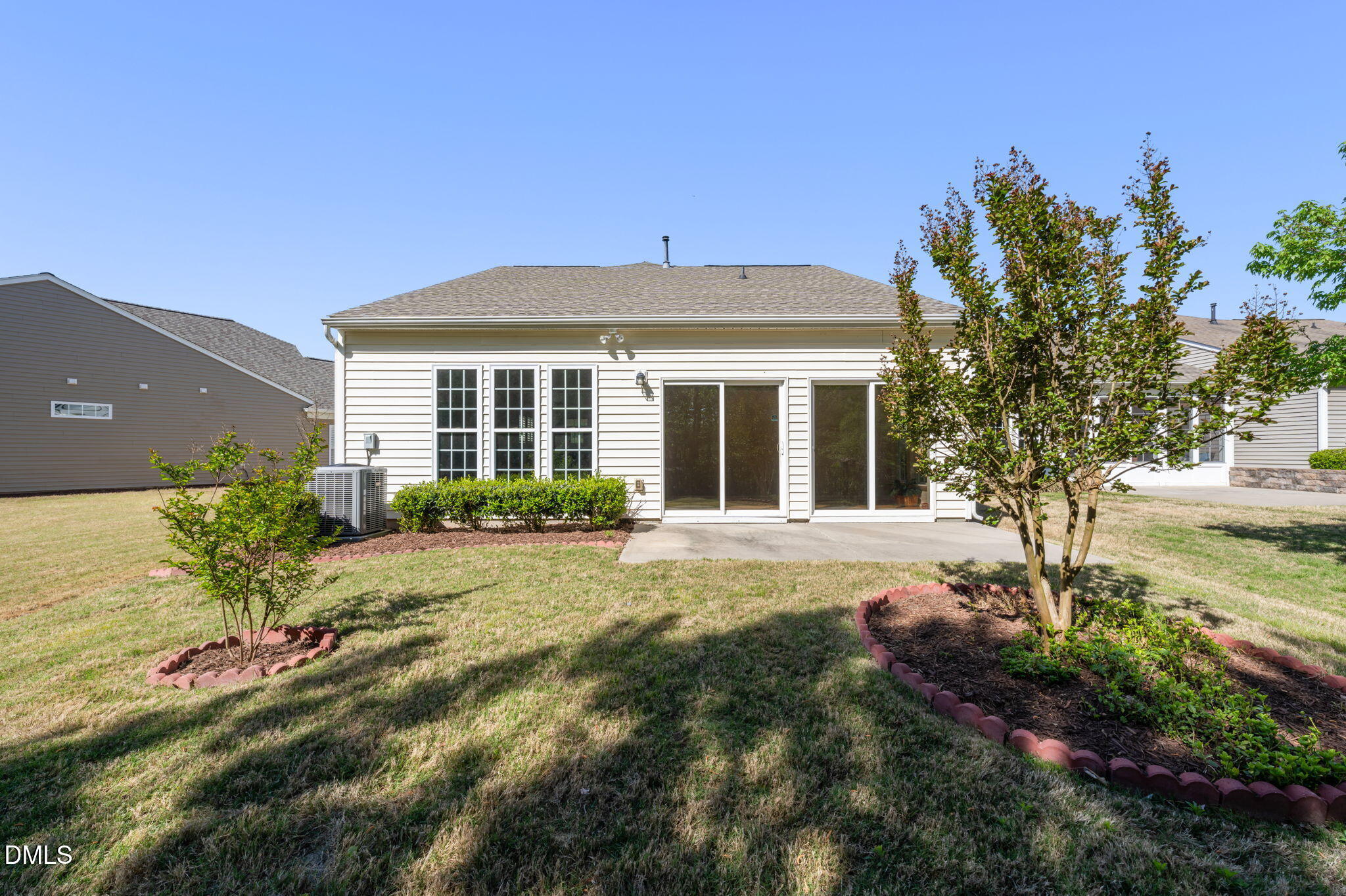 555 Tomkins Loop Cary, NC 27519 - Photo 33 of 50 a front view of a house with a garden