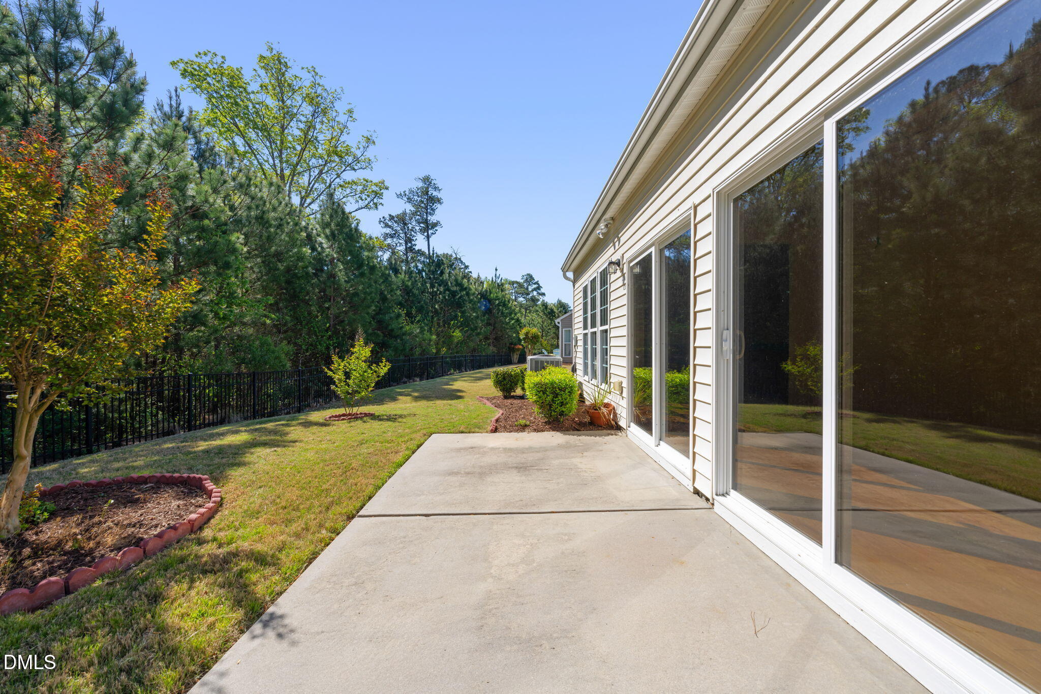 555 Tomkins Loop Cary, NC 27519 - Photo 34 of 50 a view of a house with backyard and porch