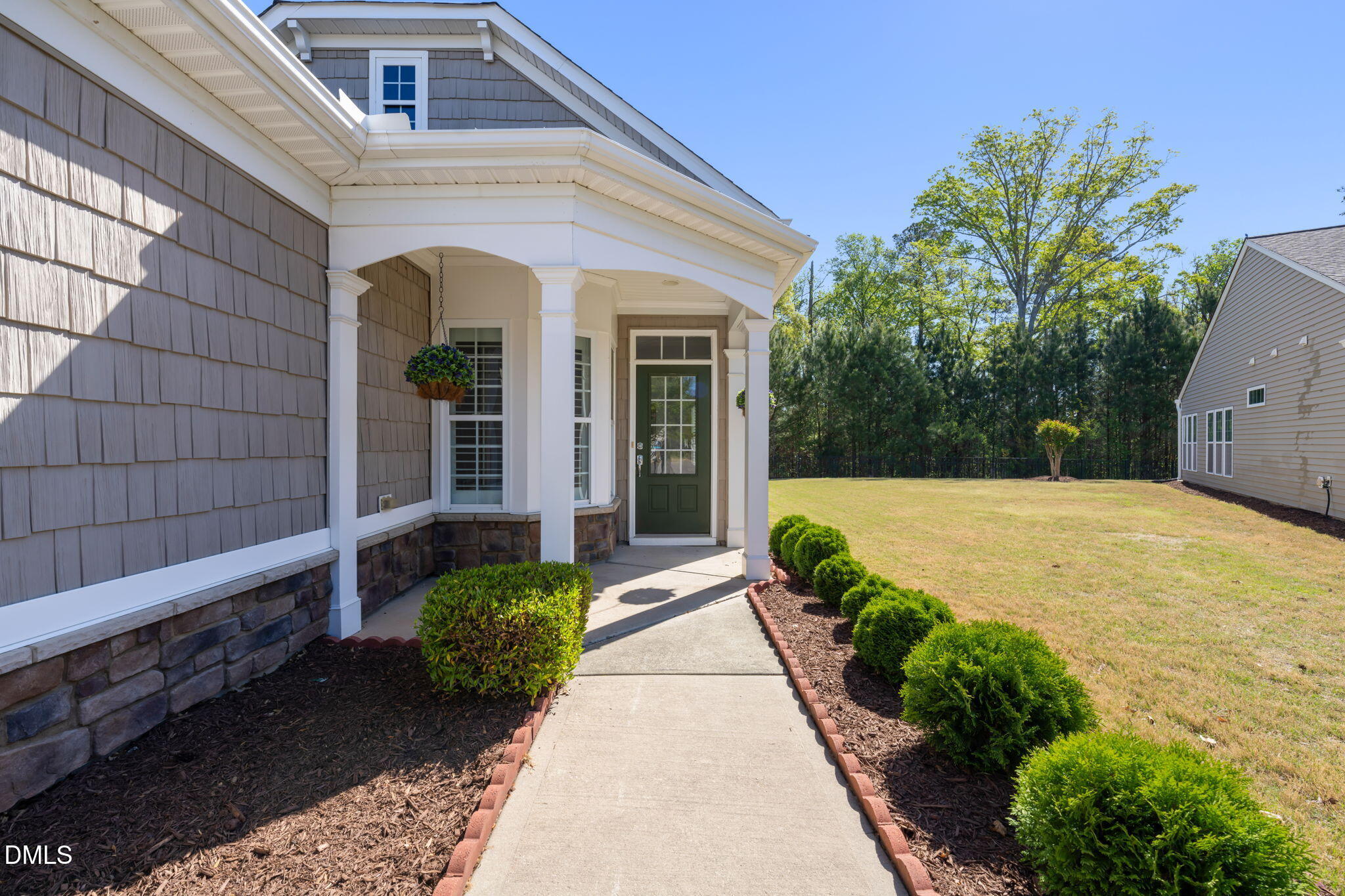 555 Tomkins Loop Cary, NC 27519 - Photo 3 of 50 a view of yellow house with potted plants
