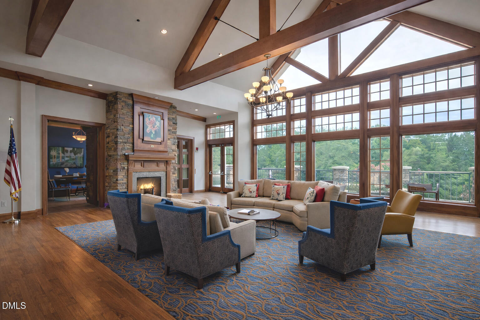 555 Tomkins Loop Cary, NC 27519 - Photo 48 of 50 a living room with furniture large windows and wooden floor