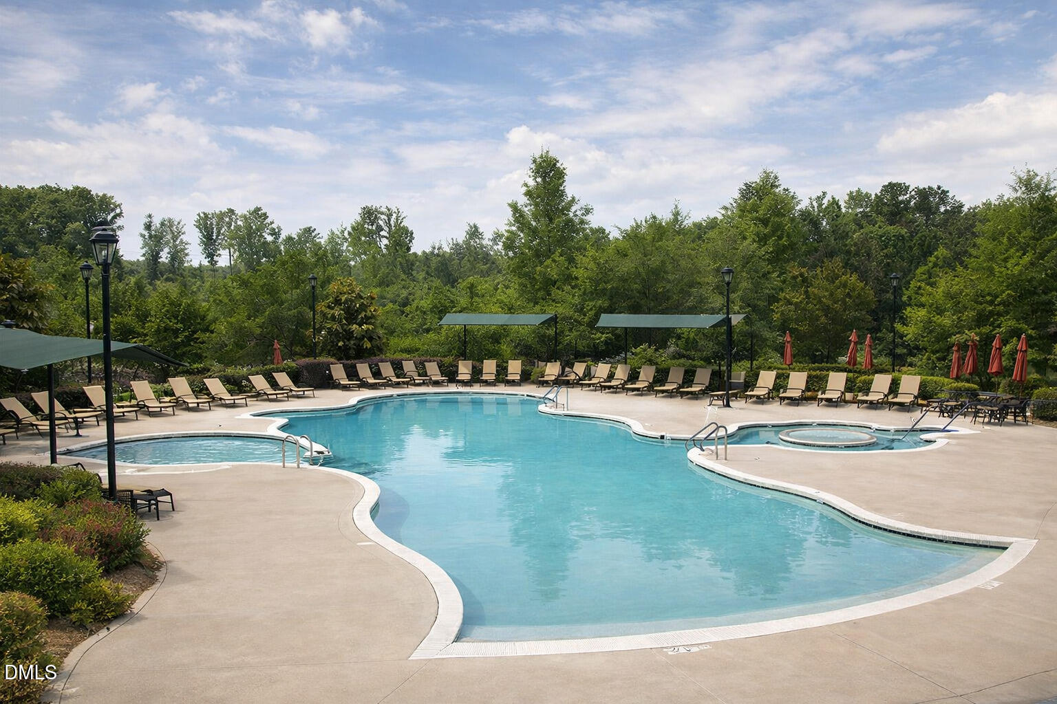 555 Tomkins Loop Cary, NC 27519 - Photo 49 of 50 a view of a swimming pool with outdoor seating and plants