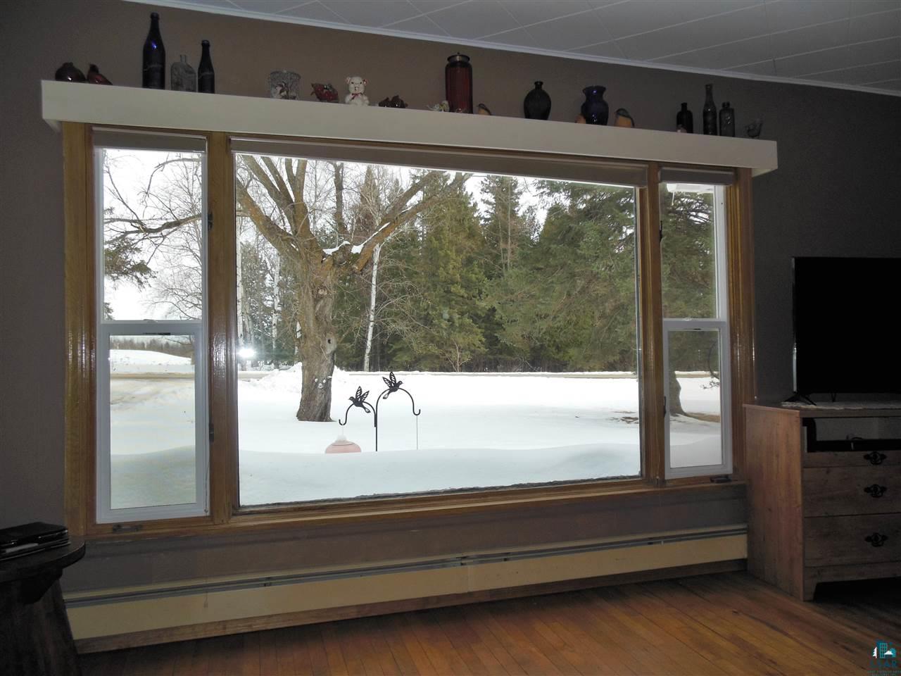 585 Center Road Wright, MN 55798 - Photo 11 of 24 Watch the birds and wildlife while relaxing in the living room