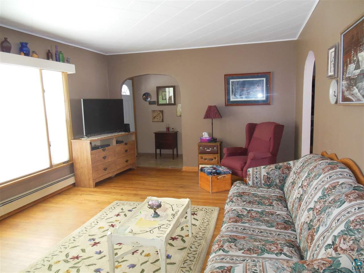 585 Center Road Wright, MN 55798 - Photo 8 of 24 Spacious living room with original hardwood floors