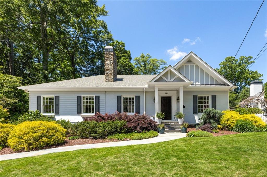 241 Lamont Drive Decatur, GA 30030 - Photo 1 of 1 a front view of a house with a yard and potted plants