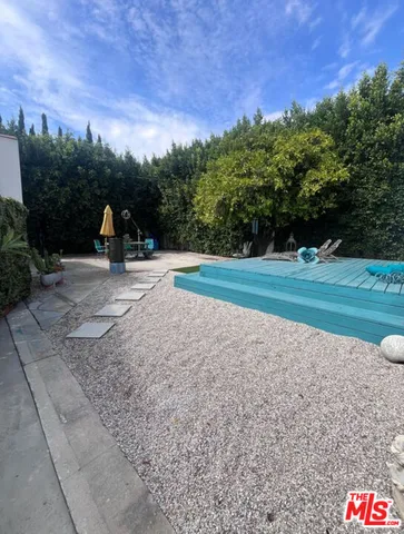 a childrens park with trees in the background